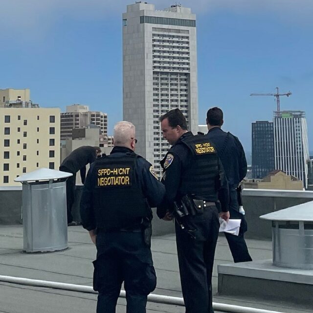 Image of Crisis Intervention Team members assisting individual in need